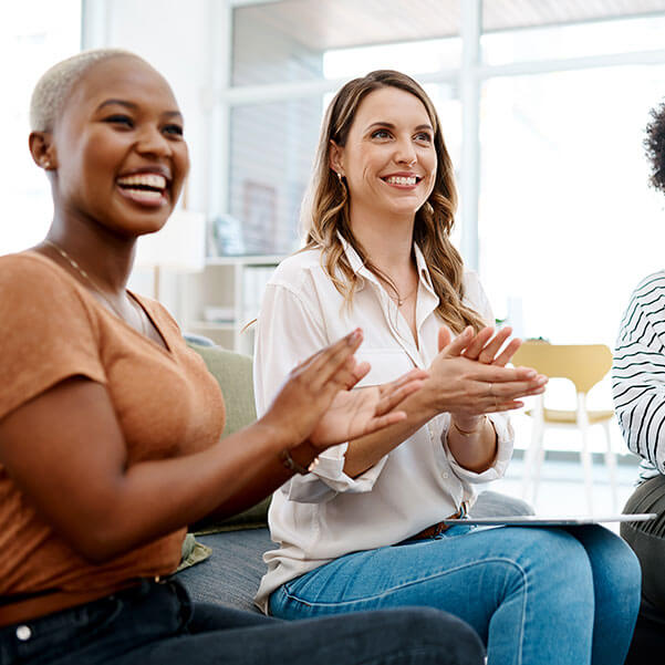 A group of women having a meeting in an office setting